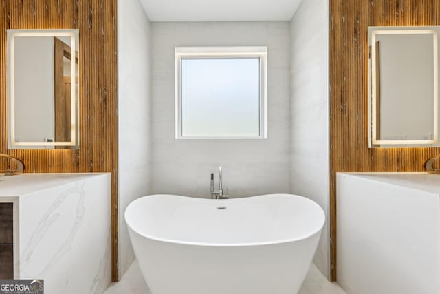 bathroom featuring a soaking tub