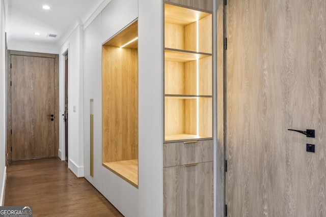 hall with ornamental molding, visible vents, recessed lighting, and wood finished floors