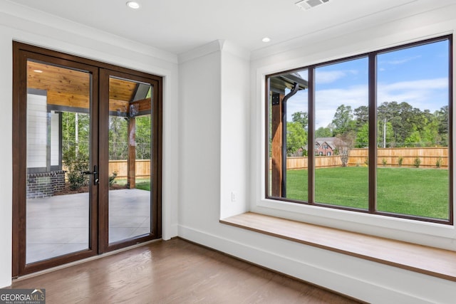 doorway with visible vents, recessed lighting, wood finished floors, french doors, and baseboards