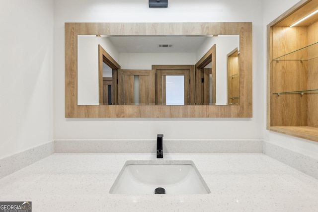 bathroom featuring visible vents and vanity