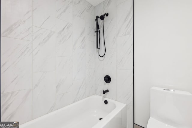 bathroom with toilet and tub / shower combination