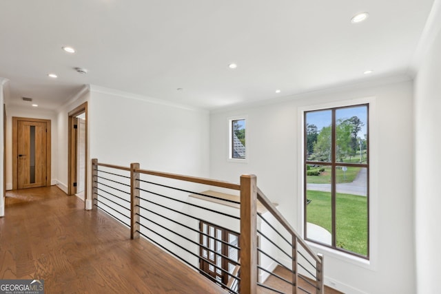 corridor with crown molding, an upstairs landing, recessed lighting, and a healthy amount of sunlight