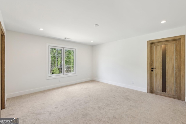 interior space with carpet floors, baseboards, and recessed lighting