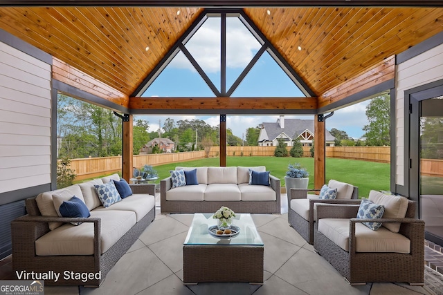 sunroom / solarium with an outdoor living space and a healthy amount of sunlight