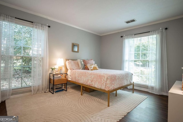 378 Beechwood Dr, Athens, GA 30606 - bedroom featuring wood finished floors, baseboards, ornamental molding, and visible vents