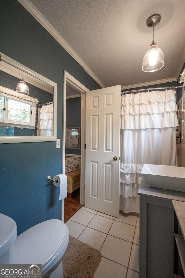 378 Beechwood Dr, Athens, GA 30606 - bathroom featuring a shower with shower curtain, toilet, crown molding, vanity, and tile patterned flooring