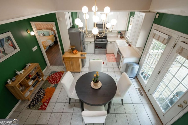 378 Beechwood Dr, Athens, GA 30606 - dining room with visible vents, a chandelier, and light tile patterned flooring