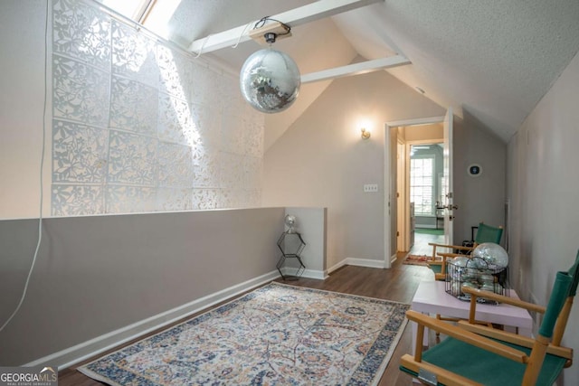 378 Beechwood Dr, Athens, GA 30606 - sitting room with baseboards, a textured ceiling, vaulted ceiling, and wood finished floors