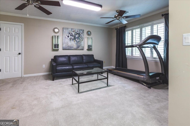 carpeted living room featuring ceiling fan, baseboards, and ornamental molding