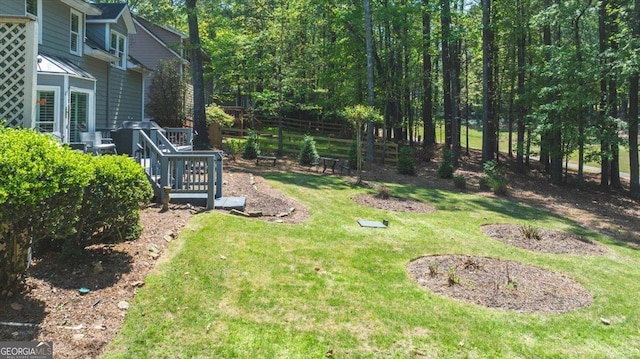 view of yard featuring fence
