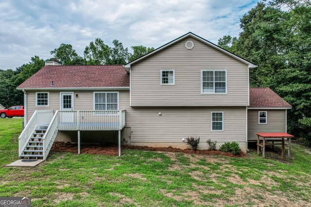 61 Meadowbrook Ln, Carrollton, GA 30117 - rear view of property featuring a deck, a lawn, stairs, a shingled roof, and a chimney