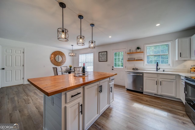 61 Meadowbrook Ln, Carrollton, GA 30117 - kitchen featuring appliances with stainless steel finishes, wood counters, white cabinets, wood finished floors, and recessed lighting