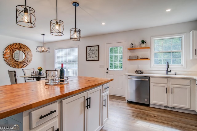 61 Meadowbrook Ln, Carrollton, GA 30117 - kitchen with stainless steel dishwasher, wood counters, wood finished floors, white cabinetry, and recessed lighting