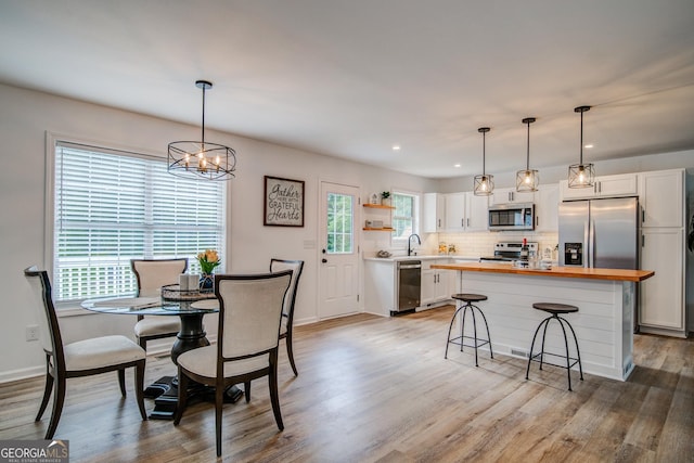 61 Meadowbrook Ln, Carrollton, GA 30117 - dining space featuring light wood-type flooring, a chandelier, and recessed lighting