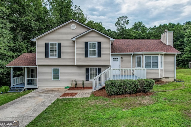 61 Meadowbrook Ln, Carrollton, GA 30117 - tri-level home featuring a chimney, a front yard, concrete driveway, and roof with shingles
