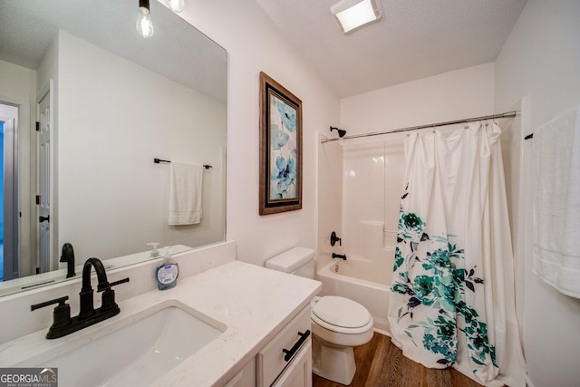 61 Meadowbrook Ln, Carrollton, GA 30117 - bathroom with vanity, wood finished floors, shower / bath combo with shower curtain, and a textured ceiling