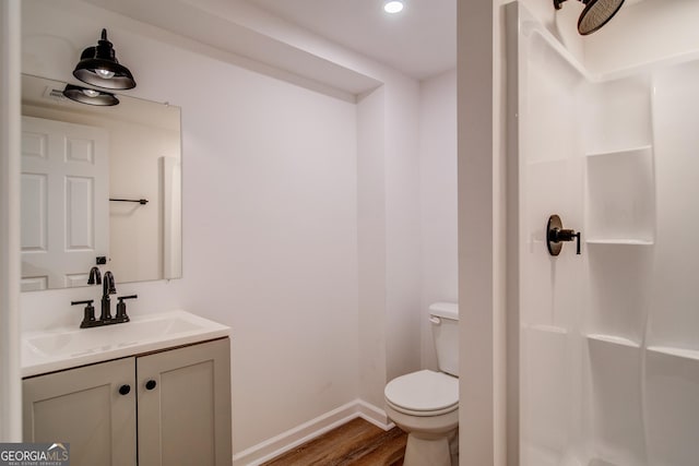61 Meadowbrook Ln, Carrollton, GA 30117 - bathroom featuring wood finished floors, vanity, a shower, and recessed lighting