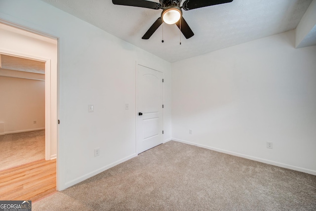 61 Meadowbrook Ln, Carrollton, GA 30117 - unfurnished bedroom with carpet flooring and a ceiling fan
