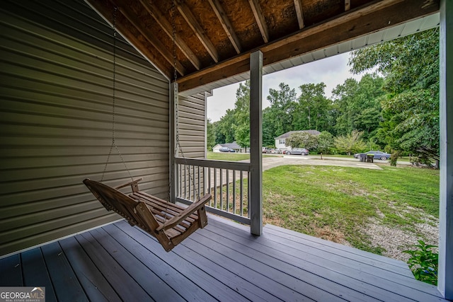 61 Meadowbrook Ln, Carrollton, GA 30117 - wooden porch featuring a yard