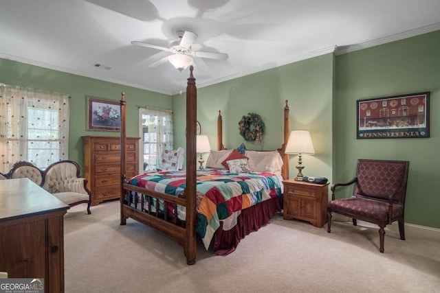 bedroom featuring crown molding, visible vents, a ceiling fan, and light carpet