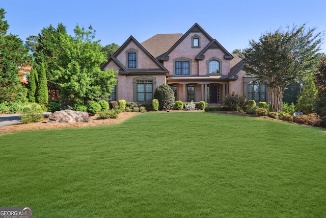 3704 Wilkins Cir, Powder Springs, GA 30127 - french country home featuring brick siding and a front lawn