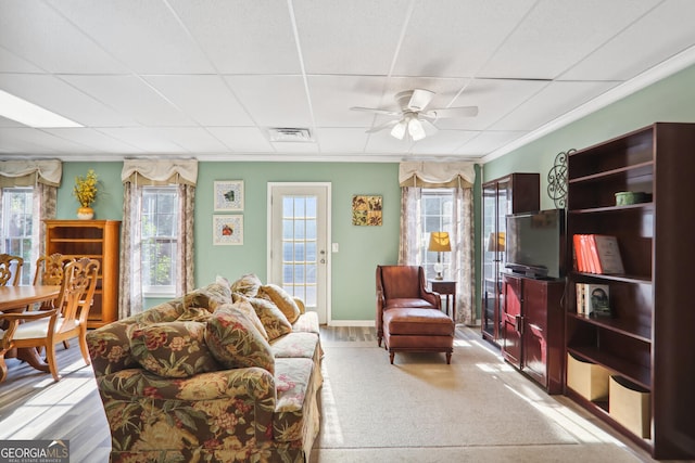 3704 Wilkins Cir, Powder Springs, GA 30127 - living area with a ceiling fan, ornamental molding, plenty of natural light, and a drop ceiling