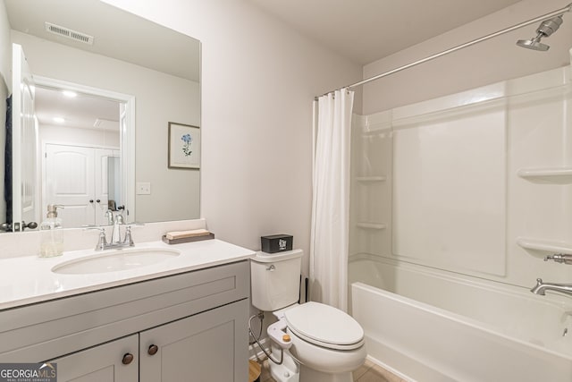 bathroom featuring shower / bath combo, visible vents, toilet, and vanity