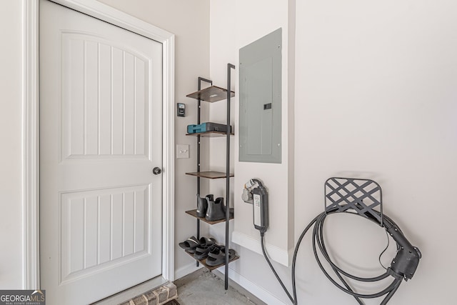 interior space with electric panel and baseboards