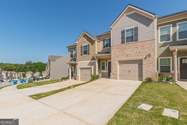view of front of house with a garage, a front lawn, brick siding, driveway, and a residential view