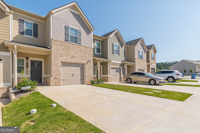 townhome / multi-family property with brick siding, an attached garage, a residential view, and driveway
