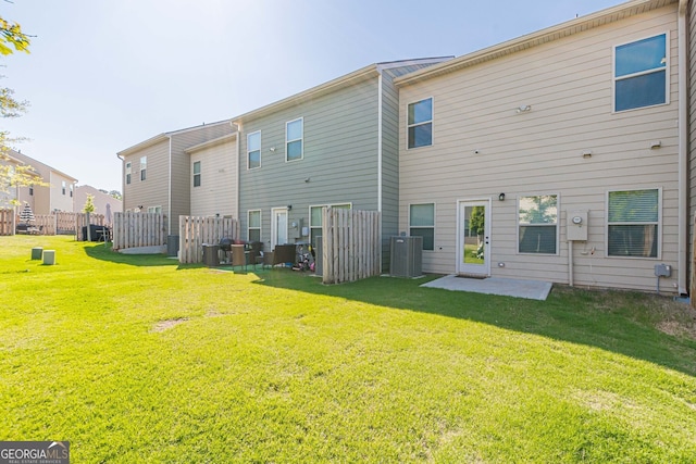 back of house with a patio, fence, and a lawn