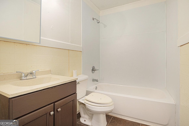 full bath with washtub / shower combination, toilet, vanity, backsplash, and tile patterned flooring