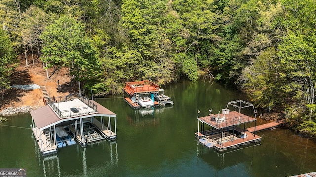 4650 Perry Rd, Gainesville, GA 30506 - view of dock with boat lift, a water view, and a wooded view