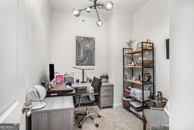 office area featuring baseboards and carpet