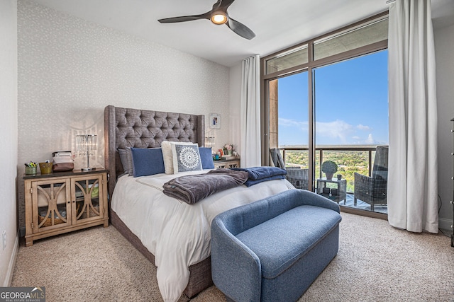 carpeted bedroom featuring ceiling fan, access to exterior, and wallpapered walls