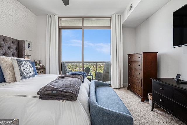 bedroom featuring visible vents, light colored carpet, a ceiling fan, floor to ceiling windows, and access to outside