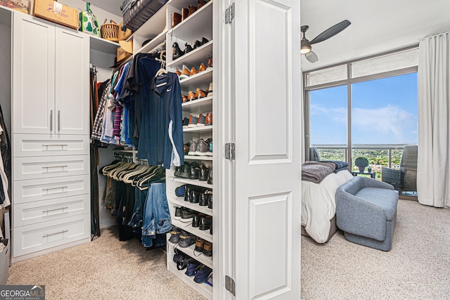 spacious closet with ceiling fan