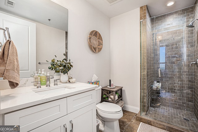 bathroom featuring a shower stall, visible vents, and toilet