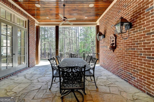 view of patio featuring french doors, a ceiling fan, and outdoor dining area
