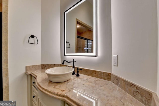 full bathroom featuring a shower and vanity