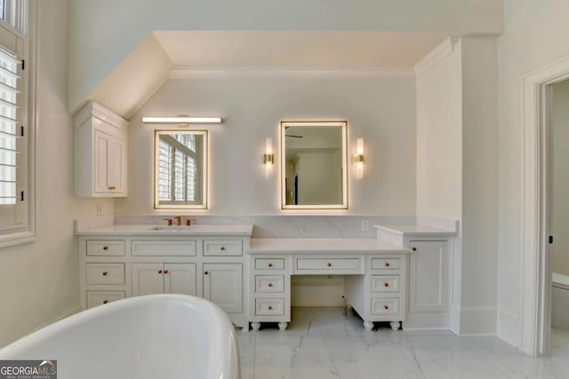 bathroom with toilet, a soaking tub, crown molding, vanity, and marble finish floor