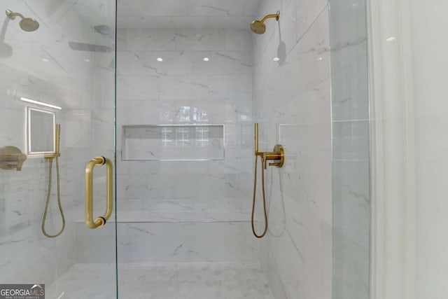 full bathroom with a marble finish shower