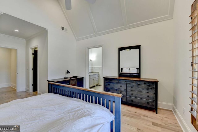 bedroom with visible vents, baseboards, light wood-type flooring, and connected bathroom