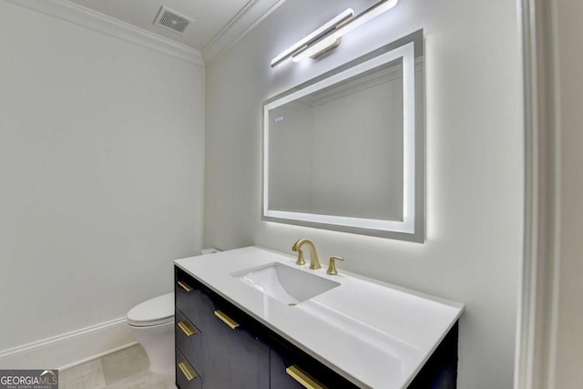 bathroom with visible vents, baseboards, ornamental molding, toilet, and vanity
