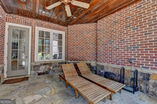 view of patio featuring ceiling fan