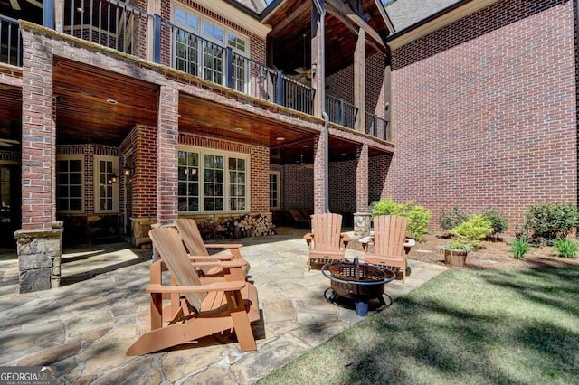view of patio with a fire pit