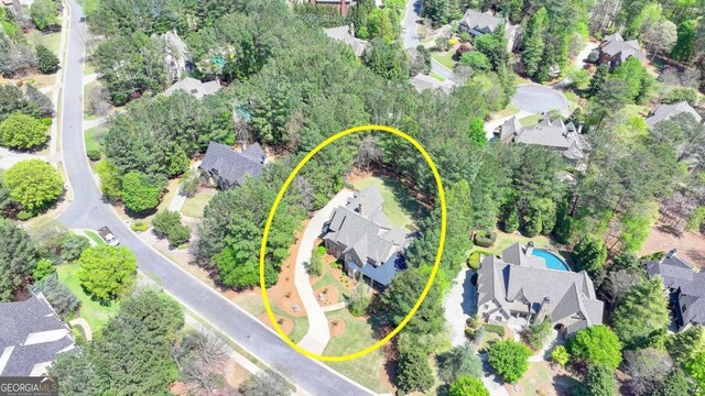 birds eye view of property with a residential view