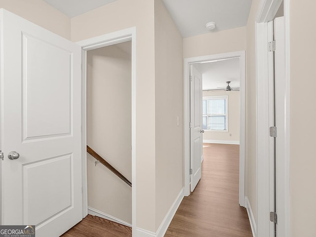 4343 Ainsley Mill Ln, Duluth, GA 30097 - hallway with an upstairs landing, baseboards, and wood finished floors