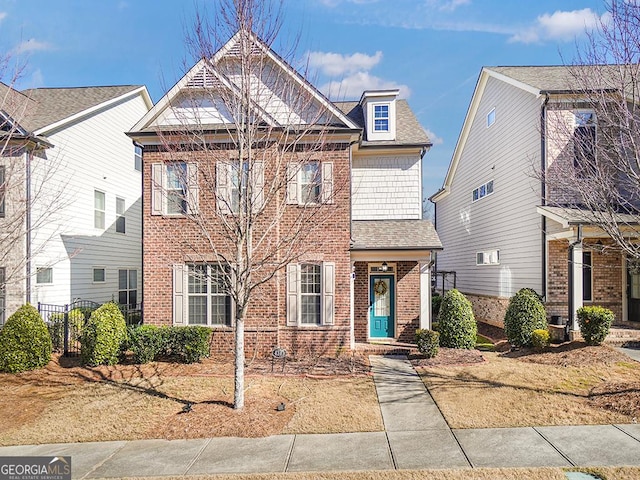 4343 Ainsley Mill Ln, Duluth, GA 30097 - view of front of house featuring brick siding, fence, and a shingled roof