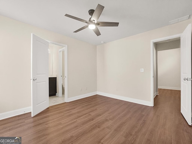 4343 Ainsley Mill Ln, Duluth, GA 30097 - unfurnished bedroom featuring wood finished floors and baseboards